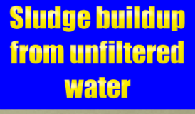 Sludge buildup from unfiltered water